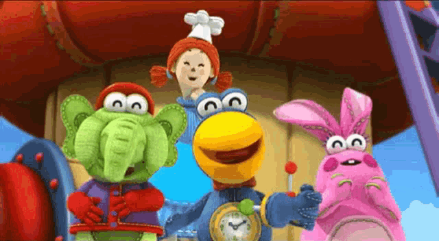 a group of stuffed animals are standing next to each other and one of them has a clock on it