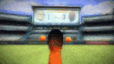 a blurred image of a soccer field with a scoreboard in the background that says 1-3