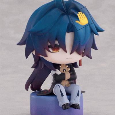 a figurine with blue hair and a yellow hand on top