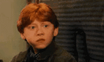 a close up of a person with red hair making a funny face .