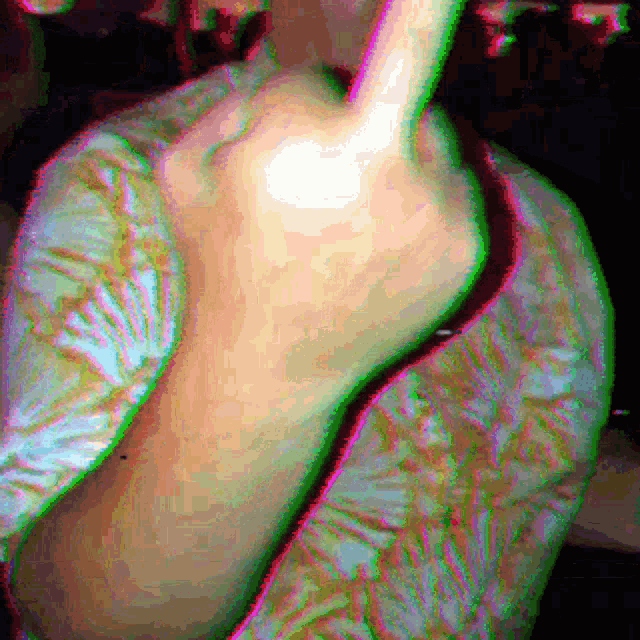 a pixelated image of a person 's back with a green stripe