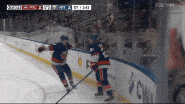a hockey game is being played between the ny islanders and the shots