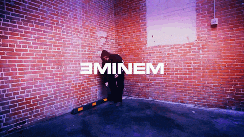 a brick wall with the word eminem in white