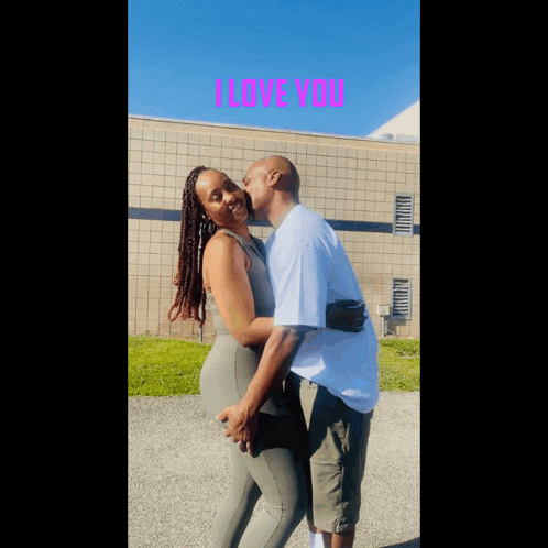 a man kisses a woman on the cheek with the words i love you behind them