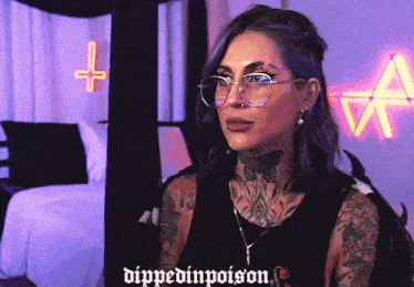 a woman with purple hair is wearing glasses and a shirt that says dipped in poison