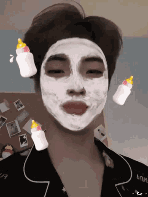 a person with a white mask on their face and a bottle on their head