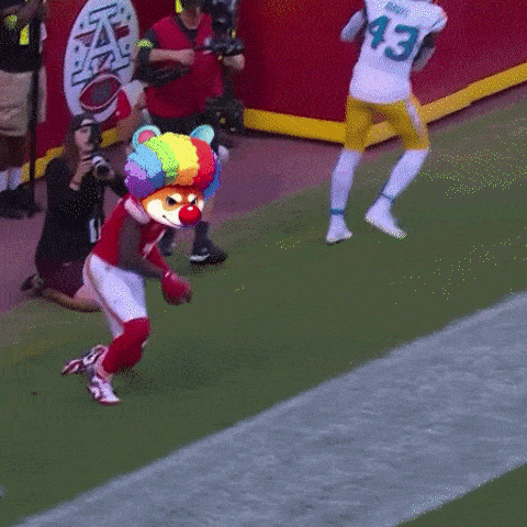 a football player wearing a number 43 jersey runs on the field