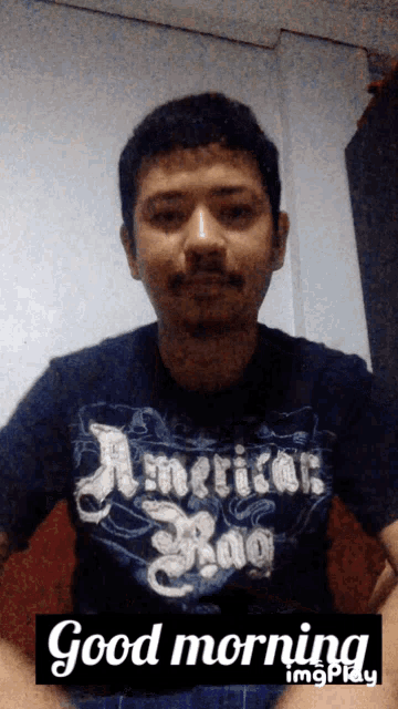 a man wearing a shirt that says american rag on it