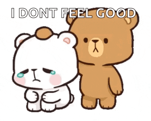 a couple of teddy bears standing next to each other .