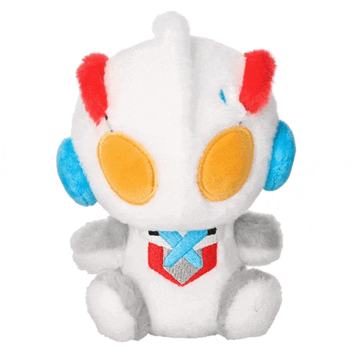 a white stuffed animal with red and blue ears has a blue x on its chest