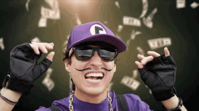 a man wearing sunglasses and a purple hat with a letter f on it