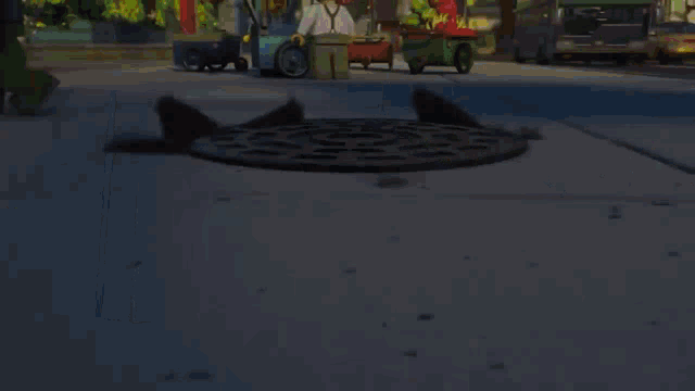 a manhole cover with a circle on it and a bus in the background