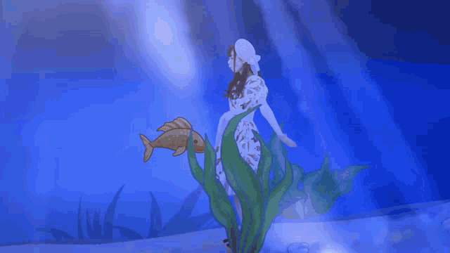 a woman in a white dress is holding a fish