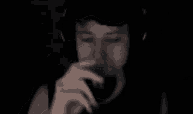 a blurry picture of a person 's face with a red glow