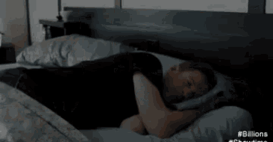 a man is laying on a bed with the words selamat pagi written above him