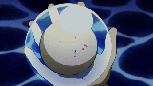 a person is holding a sphere with the number 3 written on it