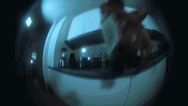 a blurred image of a person in a kitchen