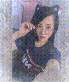 a girl wearing a cat ear headband and a shirt that says nk on it