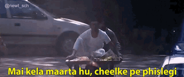a man pushing a cart with a caption that says " mai kala maarta hu "