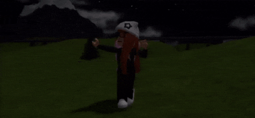a girl is standing in a field at night wearing a white hat .