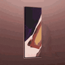 a samsung galaxy note 20 ultra is displayed on a wall .