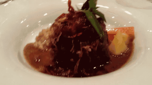 a close up of a plate of food with rice and vegetables