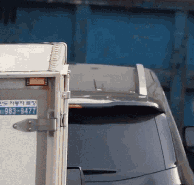 a van with a license plate that says 983-9677