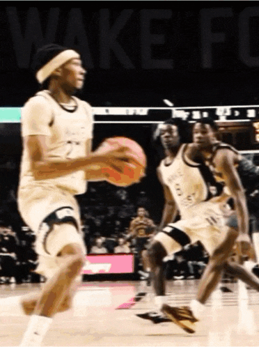 a wake forest basketball player dribbles the basketball