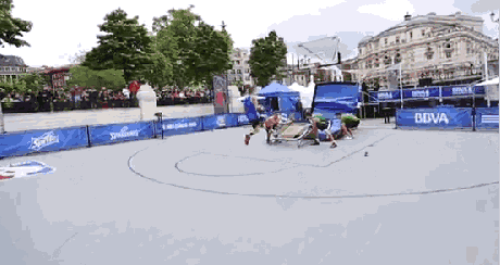 a group of people are playing basketball on a court sponsored by sprite and bova