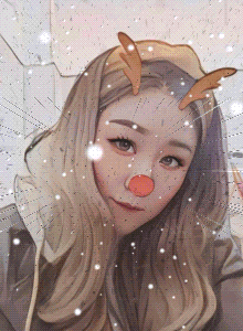 a girl with a reindeer nose and antlers on her head