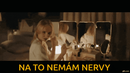 a woman is looking at herself in a mirror with the words na to nemam nervy written below her