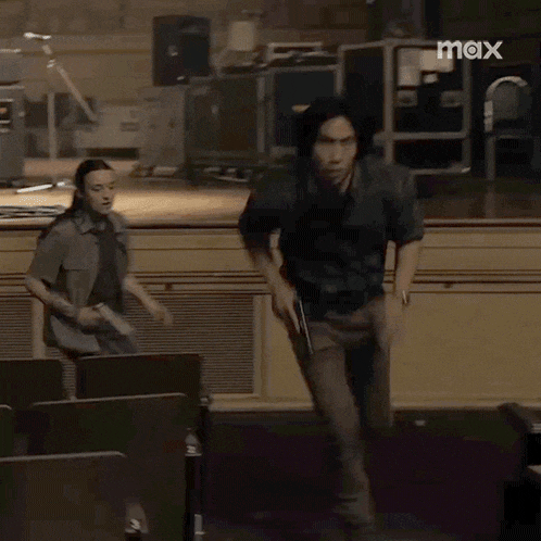 a man running with a gun in a room with max written on the bottom