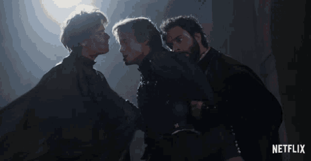 three men standing next to each other with a netflix logo on the bottom