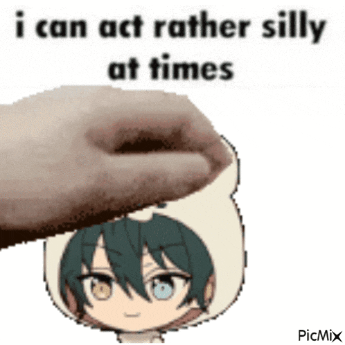 i can act rather silly at times , a hand is holding a cartoon character 's head .