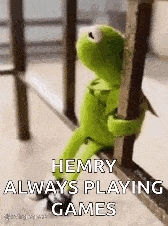 kermit the frog is sitting on a railing holding onto a railing and saying `` henry always playing games '' .