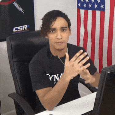 a man in a black t-shirt that says yn on it