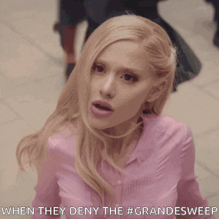 a woman in a pink shirt with the words when they deny the #grandesweep below her