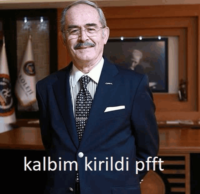 a man in a suit and tie with the words kalbim kirildi pfft written on the bottom