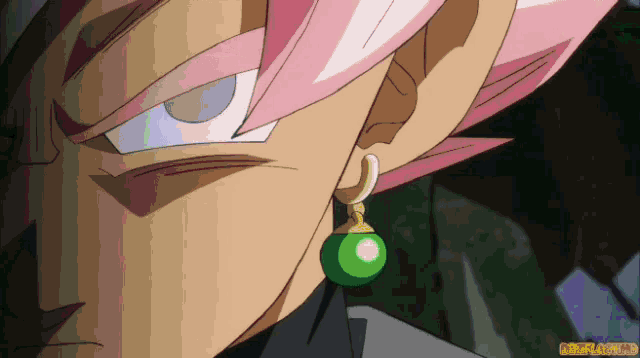 a close up of a person 's ear with a green earring that says gifflash.hd