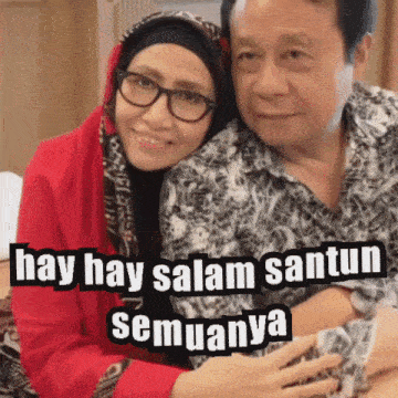 a man and a woman are posing for a picture with a caption that says hay hay salam santun semuanya