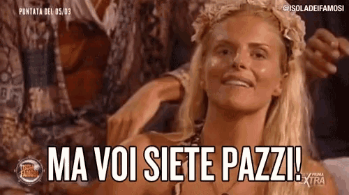 a woman with a flower crown on her head is smiling and says ma voi siete pazzi