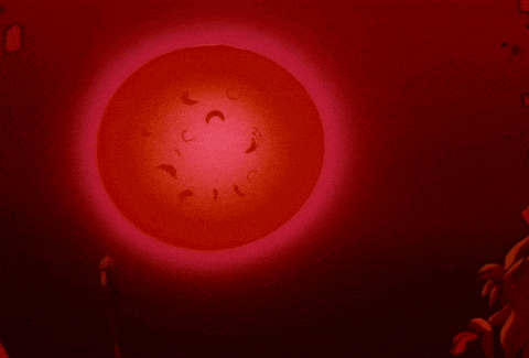 a red sphere with crescent moons in it