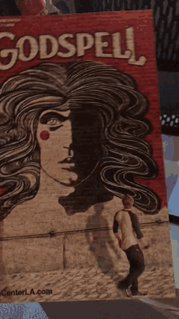 a poster with a woman 's face and the word " dspell "