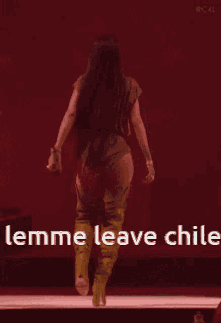 a woman is walking on a stage with the words " lemme leave chile " in the corner