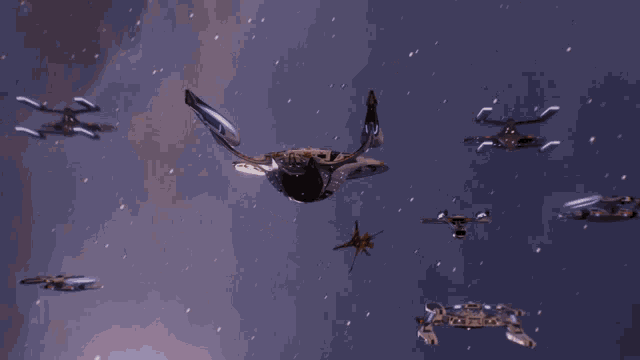 a group of space ships are flying through space and one of them has the letter h on it