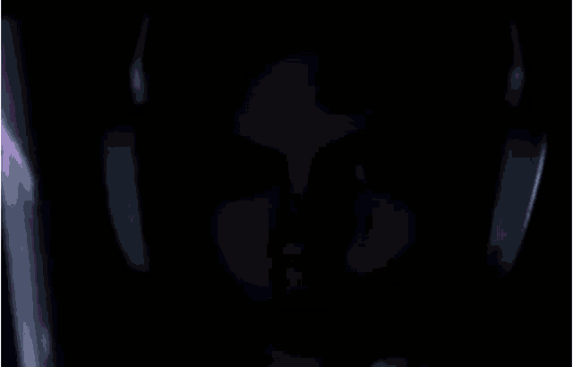 a man wearing headphones is looking at a light