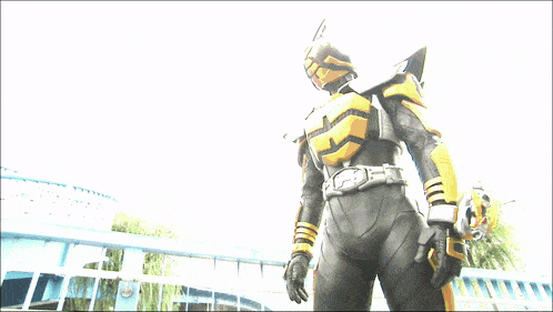 a man in a black and yellow superhero costume with a belt that says ' sd ' on it