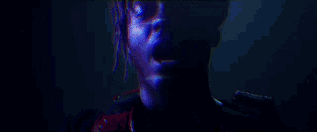 a blurry image of a person 's face with a rainbow of colors .