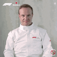 a man wearing a heineken jacket is clapping