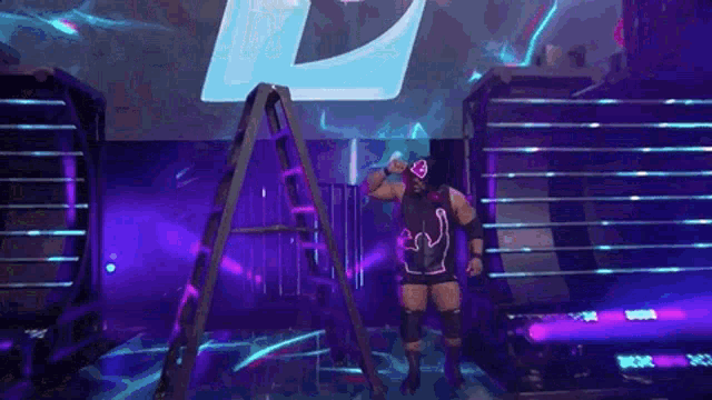 a wrestler is standing next to a ladder on a stage in front of a large letter l .